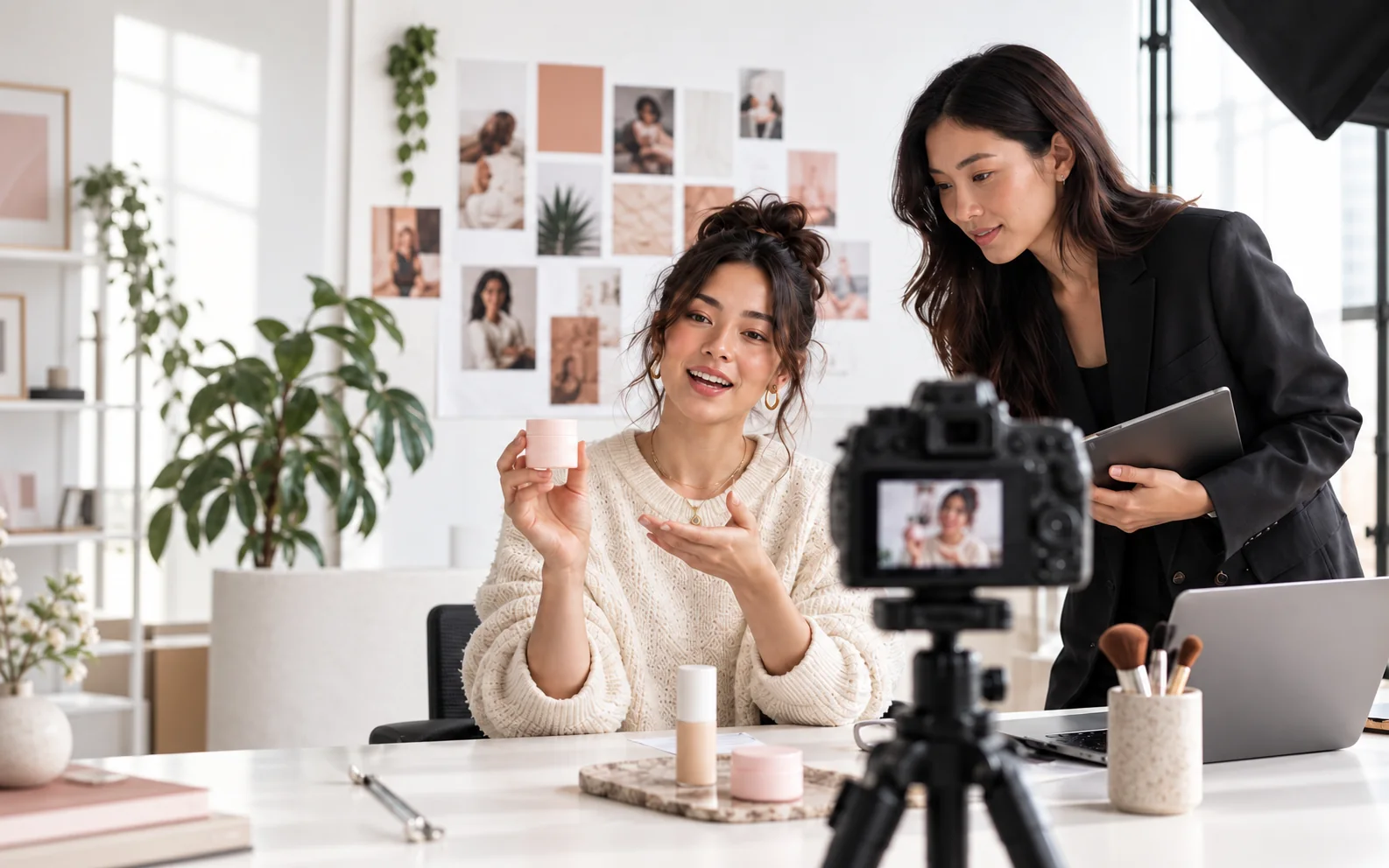 A creator and campaign lead preparing a product shoot in a bright studio